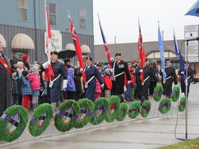 Members of the Royal Canadian Legion Branch 116 present flags at the annual Strathroy Remembrance Day service downtown Nov. 11. Well over 100 people braved cold and wet conditions to honour veterans past and present.
JACOB ROBINSON/AGE DISPATCH/QMI AGENCY