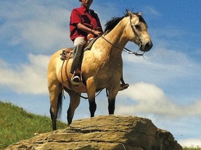 Justice Steele rides a horse at Camp Carmangay, a cost-free retreat for disadvantaged youth and youth at risk of criminal behaviour Youth learn how to ride and take care of the horses at the camp, and teach others how to ride. 
Submitted photo