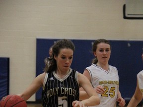 Holy Cross Centurions point guard Lauren Van Geffen is chased by Monseigneur-Bruyere Panthers defender Leah Dunlop during TVRA London District Senior Girls Basketball Single-A action in London Nov. 11, 2013. A late comeback attempt by the Cens fell just short as the Panthers won the contest 51-38.
JACOB ROBINSON/AGE DISPATCH/QMI AGENCY