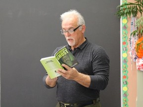 Paul Toffanello reading a chapter from his novel Popchuck's Ghost to Mr. Tracy's Grade 7/8 class at Aileen Wright.