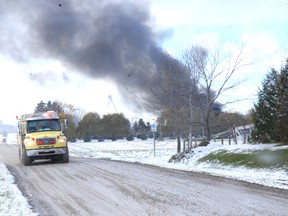 A Dutton/Duwnich Fire Service tanker shuttles from the scene of a large structure fire on Silver Clay Line just west of Currie Road Tuesday. Cause of the fire was unavailable however plumes of back smoke billowed from the scene for approximately 90 minutes. Three fire services, Dutton/Dunwich, West Elgin and Southwold had firefighters and equipment at the scene.
PATRICK BRENNAN The Chronicle