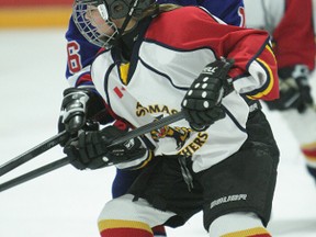 St. Thomas Panther Olivia Caines battles for the puck in a 5-0 victory over Kitchener on Sunday. (Contributed photo)