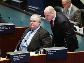 Toronto Mayor Rob Ford talks with Earl Provost during city council meeting at City Hall Wednesday, November 13, 2013. (Ernest Doroszuk/Toronto Sun)