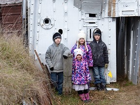 The Baxters -- Samuel, Gabrielle, Audrey and Abigail -- visited the Bill Findley Outdoor Education Centre (at the Barker-James farm east of Tillsonburg on New Road) on Sunday. The kids are standing next to a WWI "four-star hotel.' CHRIS ABBOTT/TILLSONBURG NEWS
