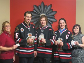 The Sarnia Legionnaires will be holding promotions throughout the month of January in a bid to raise money for St. Joseph's Hospice. Shown here with hockey tickets the Jr. 'B' club has donated to the hospice are, from left: Lesley Coene, hospice fund development co-ordinator, Legionnaire players Cody Slaght, Riley Babkirk and Captain Davis Boyer and Maria Muscedere, hospice fund development manager. PHOTO COURTESY OF ANNE TIGWELL