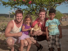 London natives and former Amazing Race Canada competitors Dave Schram and Jet Black share a smile with new friends Analize and  Ramon during a recent trip to Brazil as ambassadors for World Vision Canada.
Contributed Photo