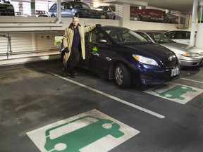 John Storm with the Community Carshare Toyota Matrix at the Carlisle St. parking garage in St. Catharines, Ont. on Nov. 12, 2013. Bob Tymczyszyn/St. Catharines Standard/Postmedia Network file photo