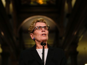 Premier Kathleen Wynne addresses the media at Queen's Park on Nov. 14 regarding the pressure to intervene at Toronto City Hall. (Stan Behal/Toronto Sun)