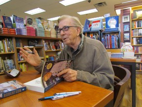 Former CTV anchor Loyd Robertson talks with fans while he signs a copy of his memoir, The Kind of Life It's Been, while visiting the Book Keeper bookstore Friday in Sarnia  PAUL MORDEN/ THE OBSERVER/ QMI AGENCY