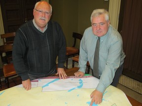 George Wallace, left, and John Bolognone of the City of Kingstonm look over the map showing the redrawn municipal election boundaries.
Paul Schliesmann/The Whig-Standard
