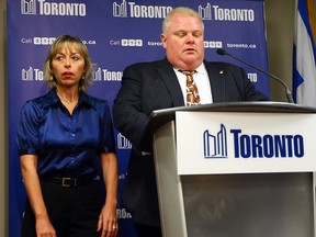 Toronto Mayor Rob Ford, alongside wife Renata, speaks to media to apologize for crude comments he made at City Hall on Nov. 14, 2013. (DAVE ABEL/Toronto Sun)