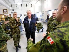 Minister of National Defence Rob Nicholson, centre, speaks with Canadian Forces personnel from CFB Petawawa about Canada's contribution to the humanitarian assistance to the Philippines as they are about to deploy, at 8 Wing/CFB Trenton Ont. Friday, Nov. 15. - FILE PHOTO BY JEROME LESSARD /The Intelligencer/QMI Agency