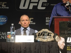 Champion Georges St. Pierre remains stoic during the press conference for UFC 167 in Las Vegas. (MATHIEU BOULAY/QMI Agency)