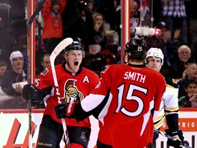 Ottawa Senators' Chris Neil celebrates his first period goal with Zack Smith during NHL action against the Boston Bruins in Ottawa, Ont. on Friday November 15, 2013. Errol McGihon/Ottawa Sun/QMI Agency