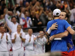 Czech Republic's Radek Stepanek (right) and Tomas Berdych celebrate after defeating Serbia's Nenad Zimonjic and Ilija Bozoljac in doubles during the Davis Cup World Group final in Belgrade November 16, 2013. (REUTERS/Stoyan Nenov)