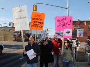 Kenora residents protest the environmental policies of the Conservative government on Saturday afternoon, Nov. 16.