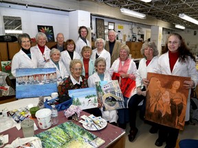 Members of the Adult Art Club at Queen Elizabeth Collegiate and Vocational Institute gather in their club room at the school. Ian MacAlpine The Whig-Standard