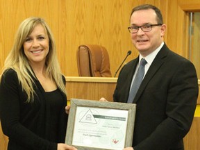 Mandee Wilson accepts a Sustainability Award for youth involvement on behalf of the local Junior Forest Wardens from Mayor Glenn McLean last week.