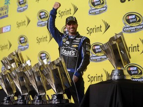 Jimmie Johnson celebrates after winning his sixth NASCAR Sprint Cup title (Jerry Lai-USA TODAY Sports)
