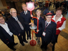 Tillsonburg Mayor John Lessif was on hand to help kick off the 2012 Salvation Army Kettle Campaign with a donation early Saturday afternoon inside the Town Centre Mall. In the photo, from left to right, are: Community Ministries Coordinator Donna Acre, Mayor Lessif, Pastor Ron Ferris, Pastor Starr Ferris, Volunteer 'Par Excellence' Bill Oliver, and Kettle Coordinator Lorraine MacDonald. Jeff Tribe/Tillsonburg News
