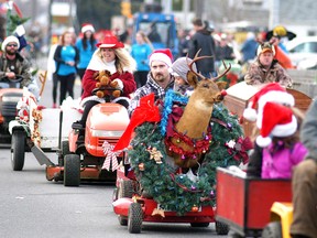 There were 260 lawn mowers/tractors in the Wallaceburg Santa Claus Parade held on Saturday. With a Red Neck theme, organizers were trying to set a Guinness World Record for having the most lawn mowers/tractors in a Santa Claus parade. They fell short of the current record, which is more than 800.