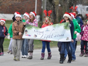 Students from St. Patrick’s School in Kinkora were dressed festively during the initial kick-off to the holiday season, the Knights of Columbus-sponsored Santa Claus parade held in Kinkora last Saturday, Nov. 16. A large crowd and plenty of youngsters watched the parade, which ended with a visit from Santa and refreshments. ANDY BADER/MITCHELL ADVOCATE