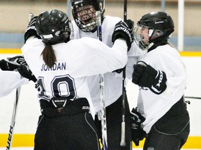 Hailey Wietersen (14) of the MDHS girls hockey team celebrates her goal with teammates Ashleigh Jordan (left) and Victoria Meinen during Huron-Perth girls hockey league action against Central Huron last Thursday at the Mitchell Arena. Wietersen’s goal was the winner in a 5-1 triumph. ANDY BADER/MITCHELL ADVOCATE