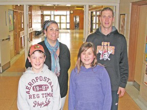 Grade 7 students Reid Ramseyer (left) and Delaney Beuermann, along with teachers Joey Jackson and A.J. Moses are pictured in the halls of MDHS last week. Both Grade 7 and 8 students and several new teachers are adjusting to their new surroundings and a new school routine. KRISTINE JEAN/MITCHELL ADVOCATE