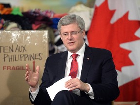 Canadian Prime Minister Stephen Harper speaks during a photo opportunity in Toronto November 18, 2013. (AARON HARRIS/REUTERS)