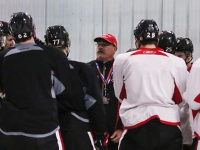 Senators coach Paul MacLean addresses his players at practice on Monday.