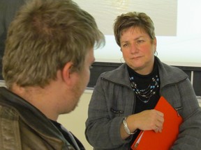 Author Michelle O'Rourke talks with an audience member following her lecture at Lambton College about the role spirituality plays at the end of life. O'Rourke is a nurse and lay minister from Chatham. PAUL MORDEN/ THE OBSERVER/ QMI AGENCY