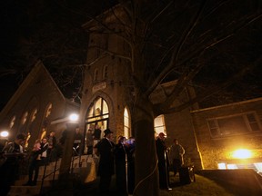 An estimated 100-plus persons of all ages attended as the Tillsonburg Country Christmas Festival officially kicked off with the annual Lighting of the Christmas Tree Sunday evening outside Avondale United Church. Carolling began at 5:30 p.m., in conjunction with a coffee house and refreshments inside the church. Mayor John Lessif joined members of the Tillsonburg Christmas Festival Committee to, with the assistance of a crowd countdown, turn the switch on the tree. Live entertainment continued inside the church subsequent to the tree lighting, which was accomplished just in time, prior to the arrival of a considerable amount of wind-swept precipitation. Jeff Tribe/Tillsonburg News