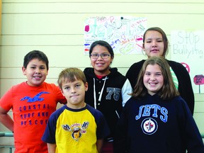 The members of the No Bully Zone at Pope John Paul II School in front of some of the anti-bullying posters they created and posted around their school. From L-R: Kendaaz White, Remington Clark, Rochelle Hunter, Serena Sinclair and Laura Polischuck.