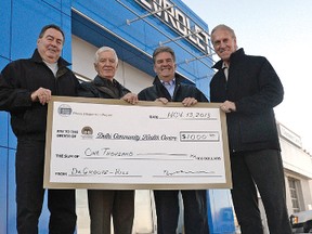 Gord Hill and Reme DeGroote of DeGroote-Hill Chevrolet Buick GMC Ltd donated $1,000 to the Delhi Community Health Centre Phase 3 expansion. From left are Joe Adam and Rick Travale, co-chairs of the Phase 3 expansion fundraising commitee, accepting the $1,000 cheque from Hill and DeGroote on Nov. 13. CHRIS ABBOTT/TILLSONBURG NEWS