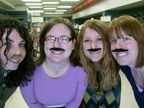 Employees at Chumleighs' downtown Princess Street location, from left, Dezurae Tordoff, Shannon Seffinga, Kathleen Cote and Catherine Reedyk, don moustaches for Movember. (Ian MacAlpine The Whig-Standard)