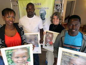 From left, Mary Minja, Reward Minja, Cherie Szucs and Lohai Moshi hold photos of children currently being supported by the Tumaini Children’s Foundation in Tanzania. Foundation members shared their story with the congregation at Avondale United Church last Sunday. File Photo by Jeff Tribe/Tillsonburg News