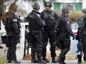 Members of Belleville police's Emergency Response Team (E.R.T.) respond to a Mental Health Act call where a man was arrested for his own protection at an Everett Street residence in the city's west end in November 2013. - FILE/JEROME LESSARD/THE INTELLIGENCER/QMI AGENCY