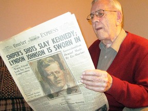Former Simcoe, Ont., Mayor Jim Earl, 84, examines an American newspaper published the day after John F. Kennedy was assassinated in Dallas, Texas, 50 years ago Friday. (MONTE SONNENBERG / SIMCOE REFORMER)