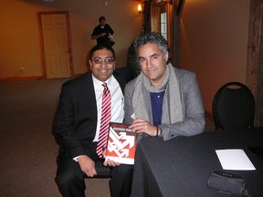 Sunil Godse (left) holds a copy of his new book, “Fail Fast. Succeed Faster”, with Canadian entrepreneur Bruce Coxon. (Photo Submitted)