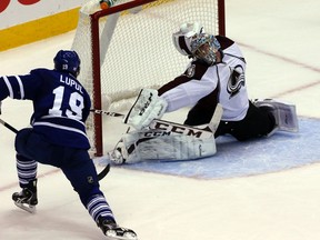 Colorado Avalanche goalie Semyon Varlamov makes a save on Toronto Maple Leafs forward Joffrey Lupul at the ACC in Toronto Tuesday October 8, 2013. (DAVE THOMAS/QMI Agency)