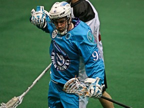 Jimmy Purves has re-signed with the National Lacrosse League's Rochester Knighthawks for another two years after winning an NLL Championship with them in 2013. The 23 year old Sarnian is entering his 4th year in the NLL and is pictured here celebrating a goal last season. Photo courtesy Rochester Knighthawks