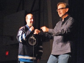 The Puck ’n’ Funny standup comedy show, which is geared towards helping raise funds for community hockey clubs, returned to Vulcan Nov. 15 at the Cultural-Recreational Centre. Here, local resident Sean Currie volunteered to get on stage during the final performance by Calgary’s Brian Stollery, who asked Currie to make sound effects for a skit. In this image, Currie did his best to make the sounds of a car starting up as Stollery acted out the scene. The event was organized by the Vulcan Minor Hockey Association, which brought the show to town for the first time last year.