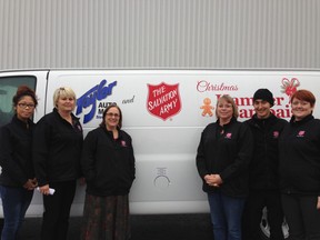 Members from The Salvation Army's Christmas Campaign team -- inclduing hampers, toy drive and kettles stand in front of the van supplied by Taylor's AutoMall.
Supplied photo