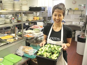 Queen's University medical student Karen Chung works in the kitchen at Martha's Table Friday afternoon, helping to prepare the meal she was sponsoring for her birthday.
Michael Lea The Whig-Standard