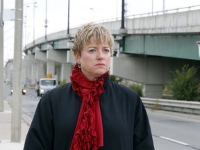 Faye Lyons of the CAA at the east end of the Gardiner Expy. (Michael Peake/Toronto Sun)