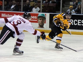 Sarnia Sting forward Nikolay Goldobin, right, fires a shot against the Guelph Storm in a contest last season. The Russian forward opened the scoring for Sarnia against the Saginaw Spirit on Saturday night, a game that the Sting lost 6-2. Observer file photo