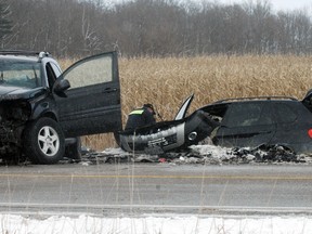 A Techinical Traffic Collision investigator takes measurements at the scene of a fatal collision on hwy. 19 just north of Tillsonburg Sunday. A 19-year-old Oxford County woman died in hospital shortly after being transported from the collision site by paramedics. TARA BOWIE / SENTINEL-REVIEW / QMI AGENCY