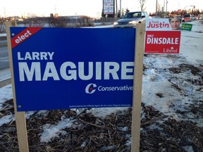 Election signs line a median outside Westman Place on 18th Street in Brandon ahead of Monday's byelection. (DANIELLA PONTICELLI/WINNIPEG SUN)