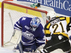 Kingston Frontenacs’ Sam Schutt looks for a rebound on Mississauga goalie Spencer Martin late in the first period of Sunday’s game. (Elliot Ferguson The Whig-Standard)