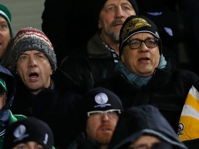 Martin Short (left) and Tom Hanks sit in the stands watching the Grey Cup game at Mosaic Stadium in Regina, Nov. 24, 2013. (TODD KOROL/Reuters)